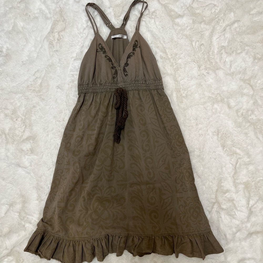 Green Spaghetti strap dress with discreet print on body.